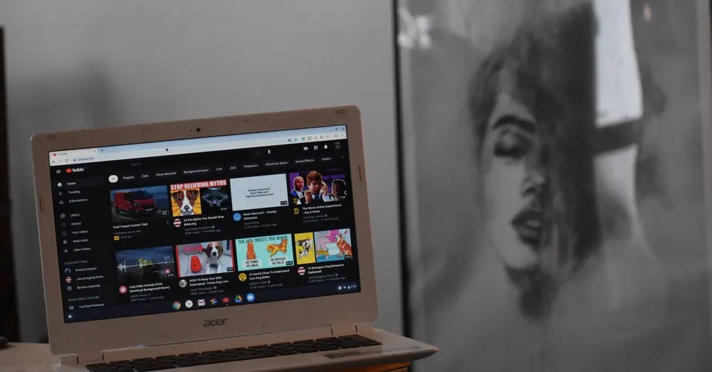 Laptop on a table showing a video player